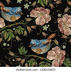 Beautiful birds and flowers of dogrose pattern. Template for clothes, textiles, t-shirt design. Embroidery wild roses and tropical birds seamless pattern