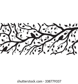 Beautiful black and white decoration: three birds are sitting on a branch