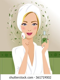 Beautiful blond woman is cleaning her face. Smiling woman in a white bathrobe is caring for skin of her face. Woman is using a cotton pad and a natural herbal facial skin care product in her bathroom.