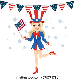 Beautiful blonde woman with Uncle Sam disguise holding flag on hand celebrating 4th of July independence day