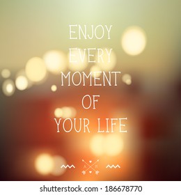 Beautiful blured vector background with bokeh effect. Evening city landscape.  Enjoy every moment of your life. Creative graphic message for your design. Quote, inspirational poster. 