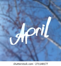 Beautiful blurred background with text and spring branches.