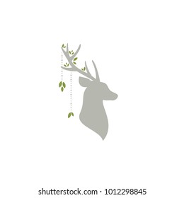 Beautiful boho card with silhouette of deer head with antlers, green leaves and beads. Wild nature clip art isolated on white. Ethnic illustration. Spring.