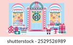 Beautiful bright toy store facade with Christmas decor. Festive shopwindow with children