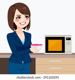 Beautiful brunette businesswoman using microwave to heat homemade food on business office kitchen