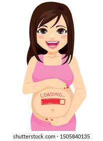 Beautiful brunette happy pregnant woman with loading baby text painted in red on belly holding with both hands growing concept