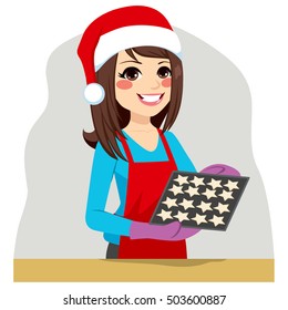 Beautiful brunette woman on Christmas time baking cookies