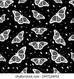 Beautiful butterflies on a seamless pattern. Print desing in black bacground
