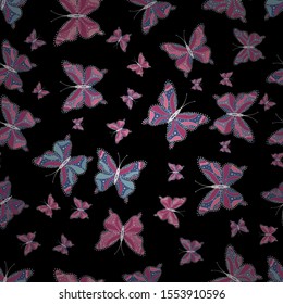 Beautiful butterfly flying on black, pink and blue background. Pattern for fabric, textile, print and invitation. Seamless pattern. Beauty in Nature. Vector.