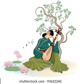 Beautiful Chinese woman sitting and playing the traditional Chinese musical instrument in the garden