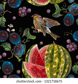 Beautiful classical embroidery tropical fruit watermelons, birds, cherry flowers and blossoming plum summer seamless pattern. Fashionable template, design of clothes 