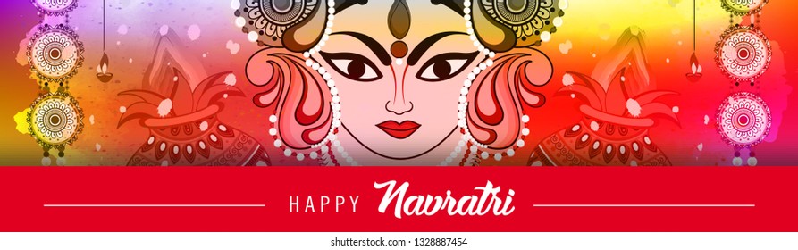 Beautiful and Creative face of Maa Durga or Devi Durga on colorful decorative festival background on the occassion of Durga Puja or chaitra Navratri Festival.