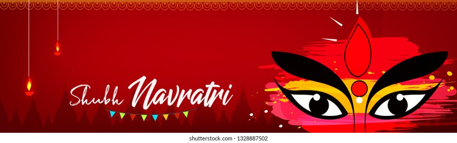 Beautiful and Creative face of Maa Durga or Devi Durga on colorful decorative festival background on the occassion of Durga Puja or chaitra Navratri Festival.