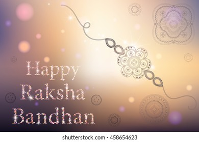 Beautiful creative rakhi on shiny background for Indian festival of brother and sister love, Happy Raksha Bandhan celebration.