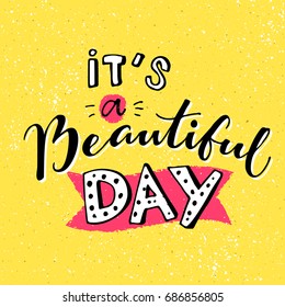 It's a beautiful day. Inspirational quote for morning. Handmade lettering on yellow background in cartoon style