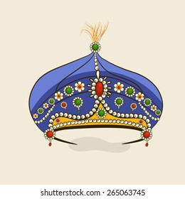 Beautiful decorative stylish blue crown isolated on beige background.