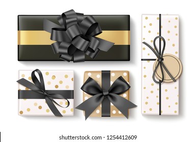 Beautiful different gift box with black bow and ribbon. Christmas decoration