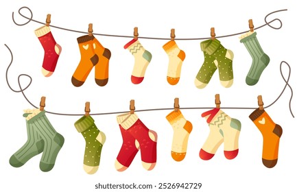 Beautiful different socks hang on a rope, secured with a clothespin. Washing, washed socks dry on a rope. Autumn and winter warm, woolen, knitted socks on a white background. An item of clothing.