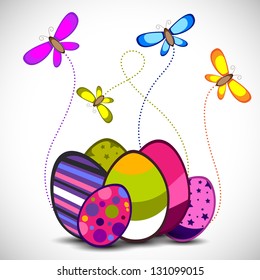 Beautiful Easter background with decorated eggs and butterflies.