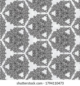 Beautiful and elegant monochromatic and grey symmetrical pattern designs on solid sheet of wallpaper.