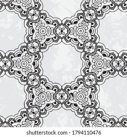 Beautiful and elegant monochromatic and grey symmetrical pattern designs on solid sheet of wallpaper.