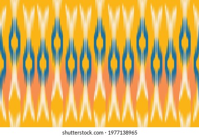 Beautiful ethnic abstract ikat art. Seamless pattern in tribal, folk embroidery, Cute Mexican style. Aztec geometric art ornament print. Design for carpet, wallpaper, clothing, wrapping, fabric,cover.