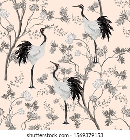 Beautiful exotic chinoiserie wallpaper. Hand drawn vintage chinese rose trees, flowers, crane birds. Floral seamless pattern on the  pink background.
