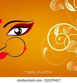 Beautiful face of hindu mythological Goddess Durga with big eyes on floral decorated yellow background for Dussehra festival celebrations. 