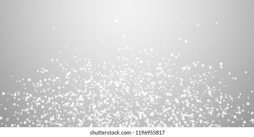 Beautiful falling snow Christmas background. Subtle flying snow flakes and stars on light grey background. Astonishing winter silver snowflake overlay template. Impressive vector illustration.