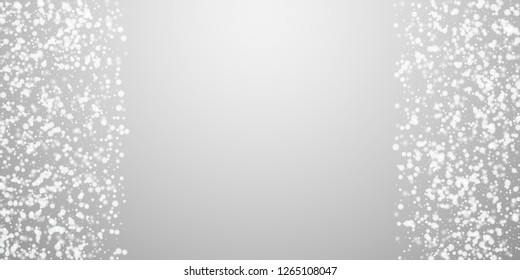 Beautiful falling snow Christmas background. Subtle flying snow flakes and stars on light grey background. Appealing winter silver snowflake overlay template. Beautiful vector illustration.
