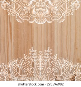 Beautiful fanciful hand drawn doodle ornament on top and bottom, on wooden realistic background with space for text. Can be used for greeting, invitation or post card. Vector illustration