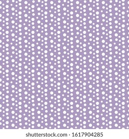 Beautiful, fashionable pattern with large and small white polka dots on a purple background. Seamless vector festive pattern. For textile, surface packaging, packaging design. Abstract design.