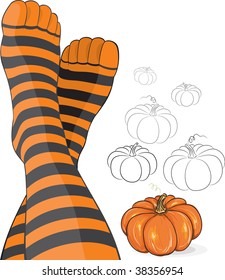 Beautiful feet in stripy socks with pumpkin