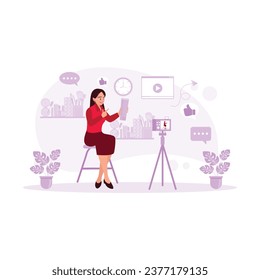 A beautiful female blogger displays cosmetic products while recording videos and giving advice for her beauty blog. Blogger concept. trend modern vector flat illustration