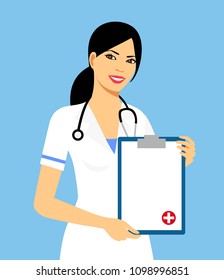 Beautiful female nurse is holding clipboard and showing document. Portrait of young nurse or medic with clipboard and stethoscope isolated on blue background