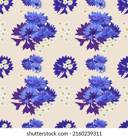 Beautiful field with small blue and white flowers. Millefleurs. Liberty style. Seamless pattern of wild cornflowers, chamomile
