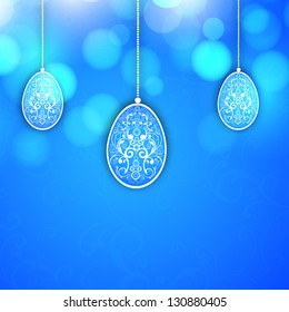 Beautiful floral decorated Easter eggs on blue background..