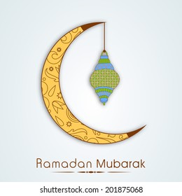 Beautiful floral decorated moon with hanging colorful lantern on shiny blue background for the celebrations of Muslim community holy month of Ramadan Mubarak. 