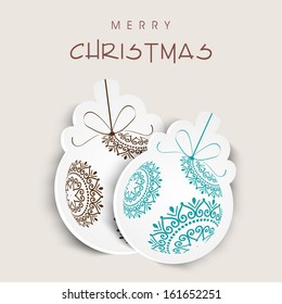 Beautiful floral decorated Xmas balls on abstract background, can be use tag, sticker or label for Merry Christmas celebration. 