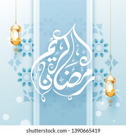 Beautiful floral decoration on blue background for Ramadan Kareem poster or banner design.
