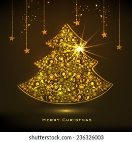 Beautiful floral design decorated golden X-mas Tree and stars on shiny brown background for Merry Christmas celebrations. 