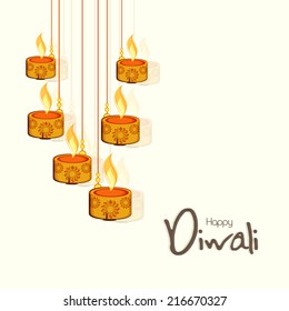 Beautiful floral design decorated illuminated oil lit lamps on beige background for Happy Diwali celebrations. 