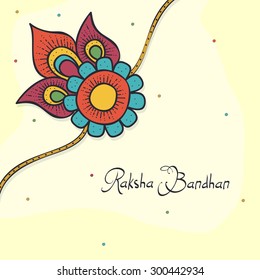 Beautiful floral design decorated rakhi on shiny yellow background for Indian festival, Raksha Bandhan celebration.