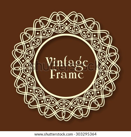 Beautiful floral design decorated rounded vintage frame on glossy brown background.
