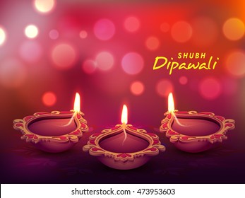 Beautiful floral, Illuminated Oil Lit Lamps on shiny blured background for Indian Festival of Lights, Happy Diwali Celebration.
