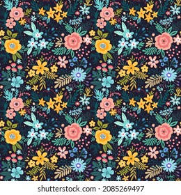 Beautiful floral pattern in abstract flowers. Small multicolor flowers. Black background. Trendy print. Floral seamless background. The elegant the template for fashion prints. Stock pattern.