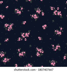 Beautiful floral pattern in small abstract flowers. Small pink  flowers. Black background. Ditsy print. Floral seamless background. The elegant the template for fashion prints.