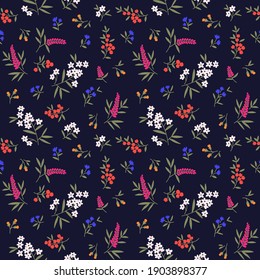 Beautiful floral pattern in small abstract flowers. Small colorful flowers. Dark blue background. Ditsy print. Floral seamless background. The elegant the template for fashion prints. Stock vector.