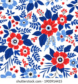 Beautiful floral pattern in small abstract flowers. Small red and blue flowers. White background. Ditsy print. Floral seamless background. The elegant the template for fashion prints.
