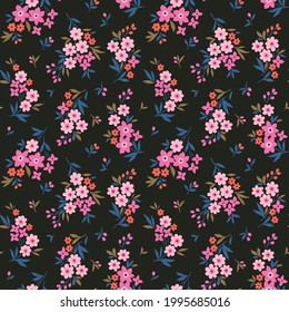 Beautiful floral pattern in small abstract flowers. Small light pink flowers. Black background. Ditsy print. Floral seamless background. The elegant the template for fashion prints. Stock pattern.